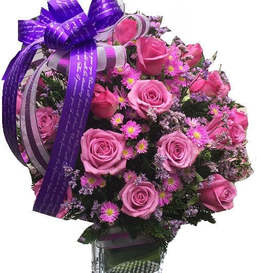purple rose in vase 500x531